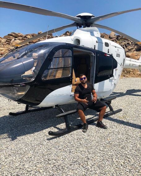  Joe Fournier Posing infront of Helicopter